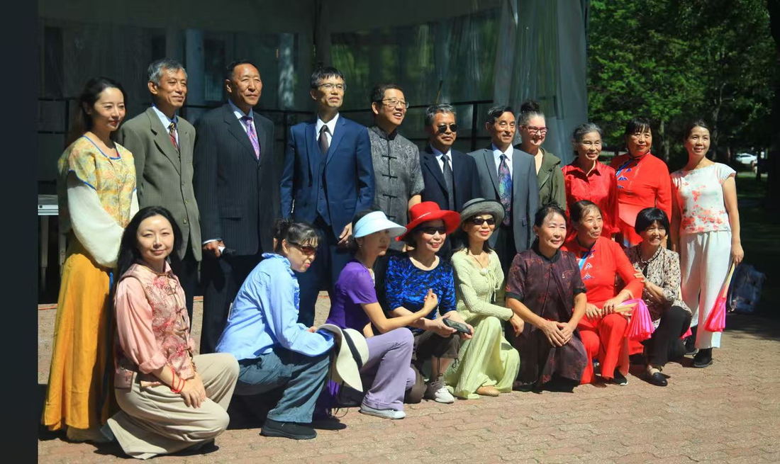 Group photo of performers and guests