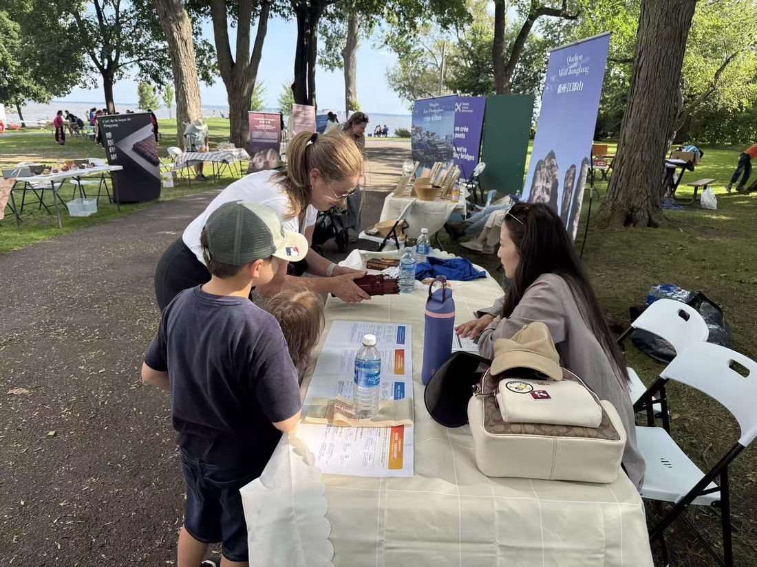 A local family at an information table